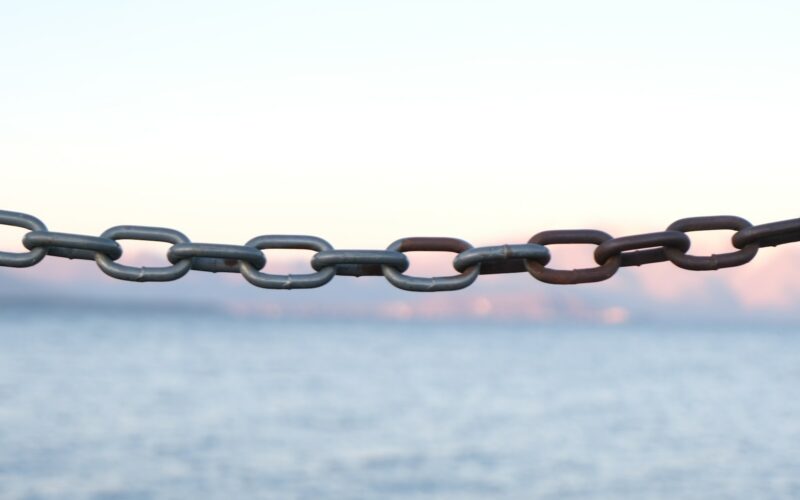 brown metal chain with white background